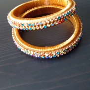 Gold silk thread bangles with multicolour stones
